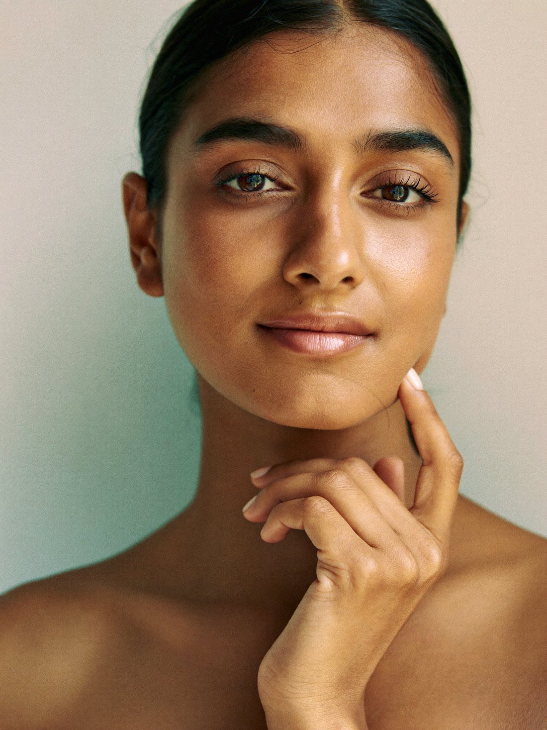 Close-up of clear, even-toned Indian skin after dermatology treatment